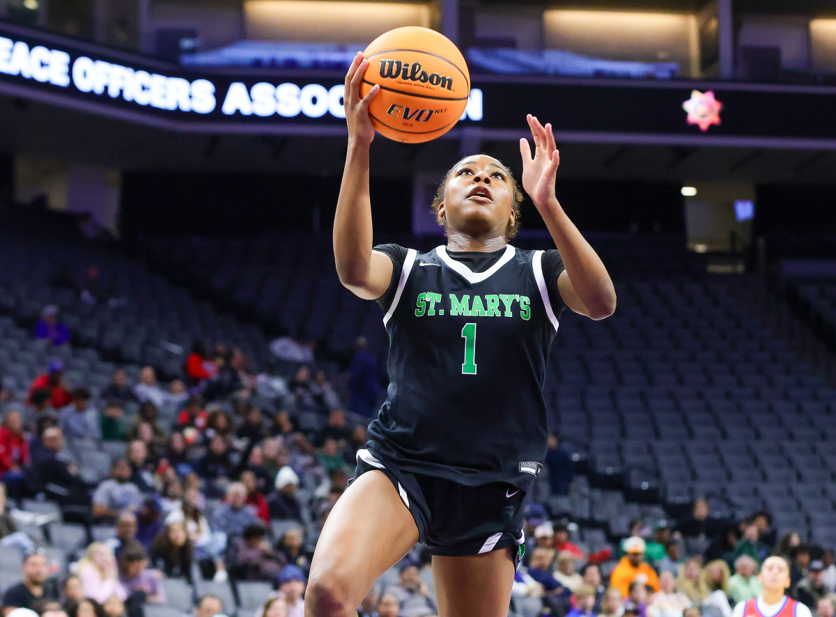 Freshman Kori Rogers swoops in for two of her game-high 21 points.